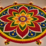 Big circle rangoli design with colorful floral petals on a floor