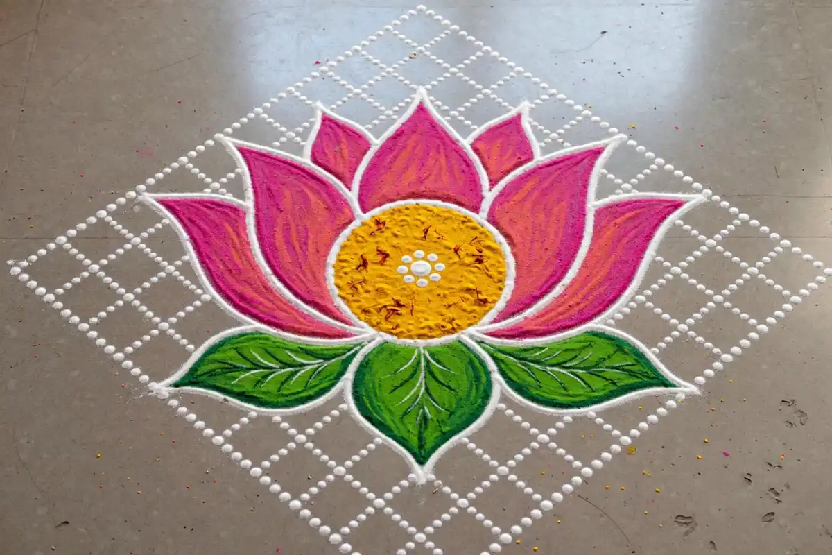 Dot lotus rangoli filled with pink and yellow colors