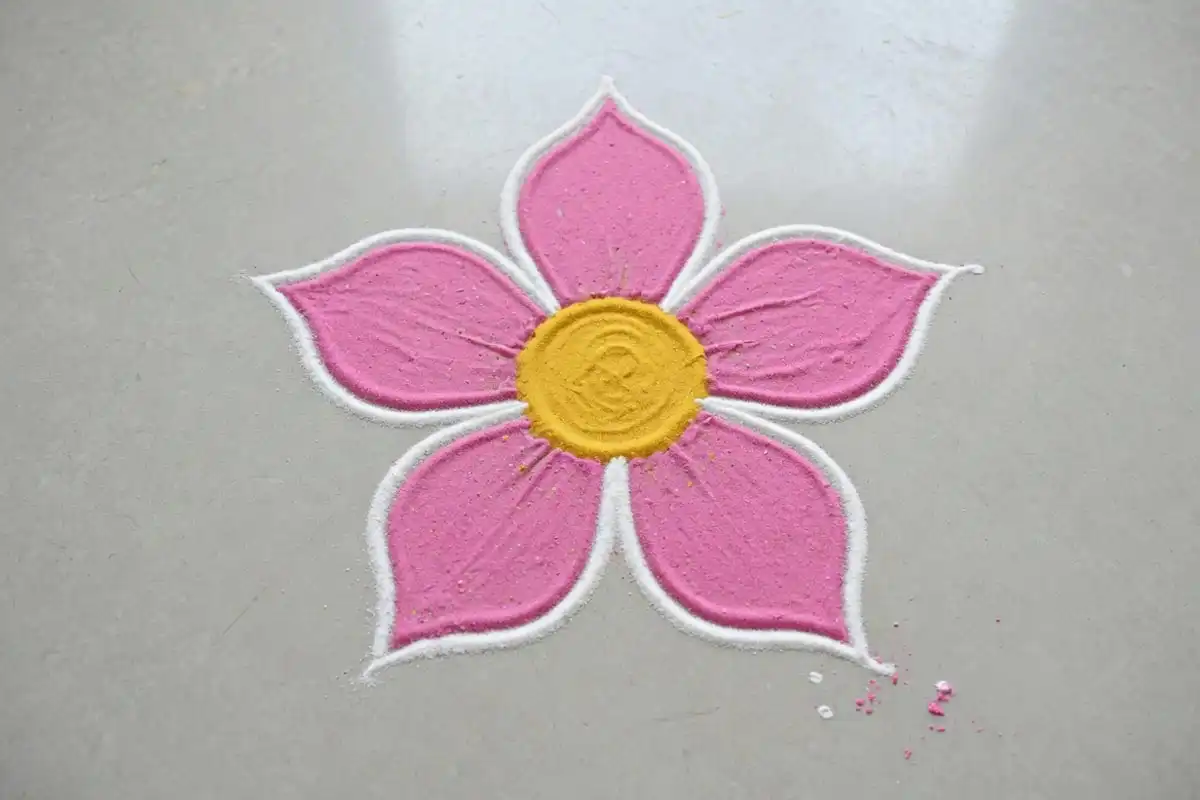 Five petal flower simple rangoli with yellow center