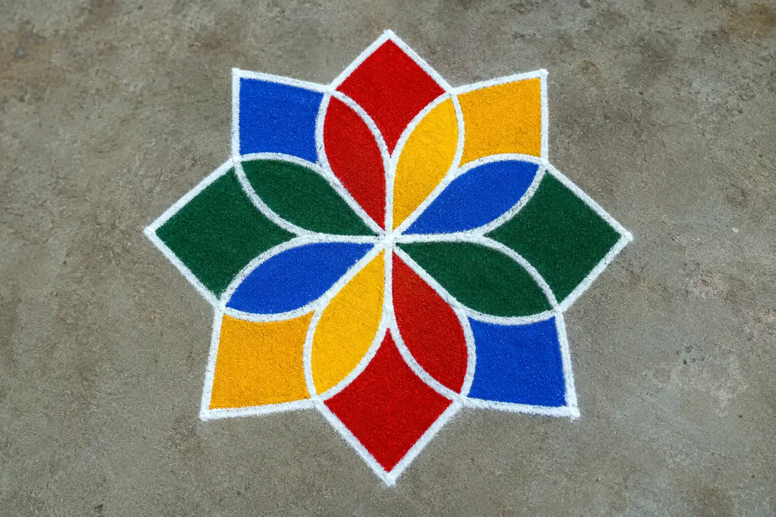 Concentric square star rangoli design with four bold colors