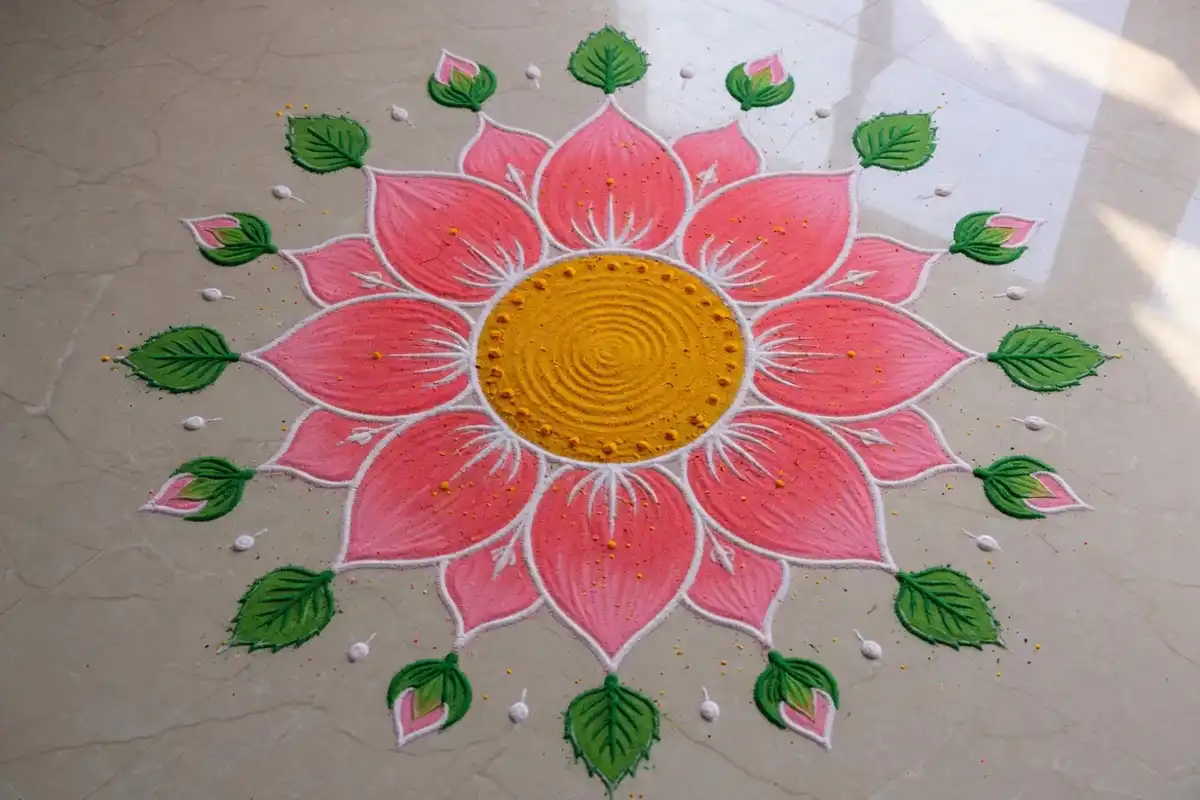 Lotus rangoli with eight pink petals and a yellow center