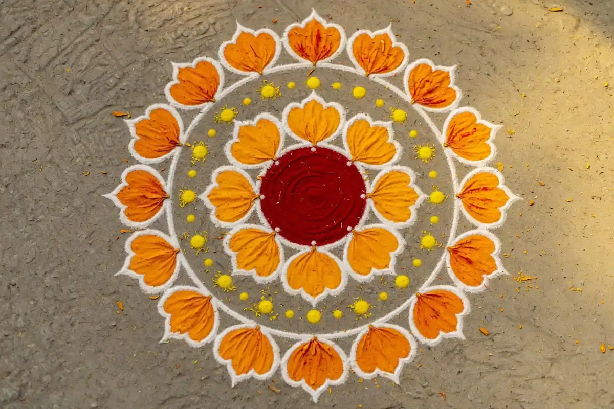 Marigold wreath rangoli with concentric orange petal rings