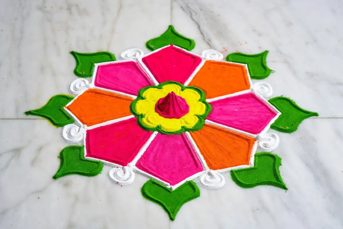 Beautiful rangoli design with colorful floral motifs on a home floor