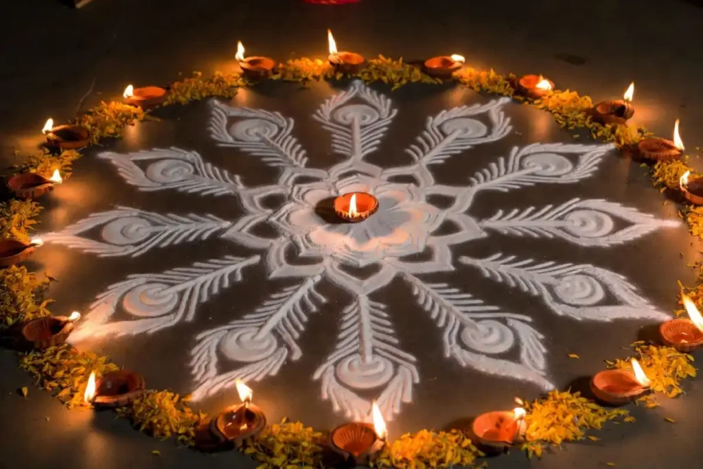 Diwali festival rangoli design with diyas and flower petals around a central motif