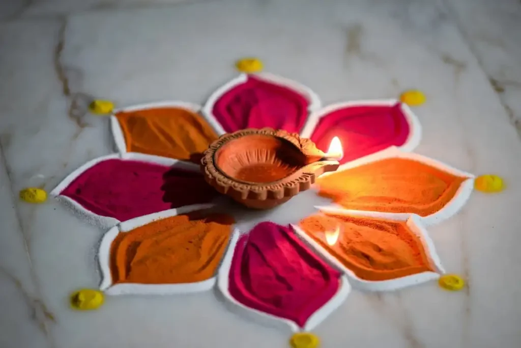 Traditional diwali rangoli design featuring a lotus flower with a diya at the center