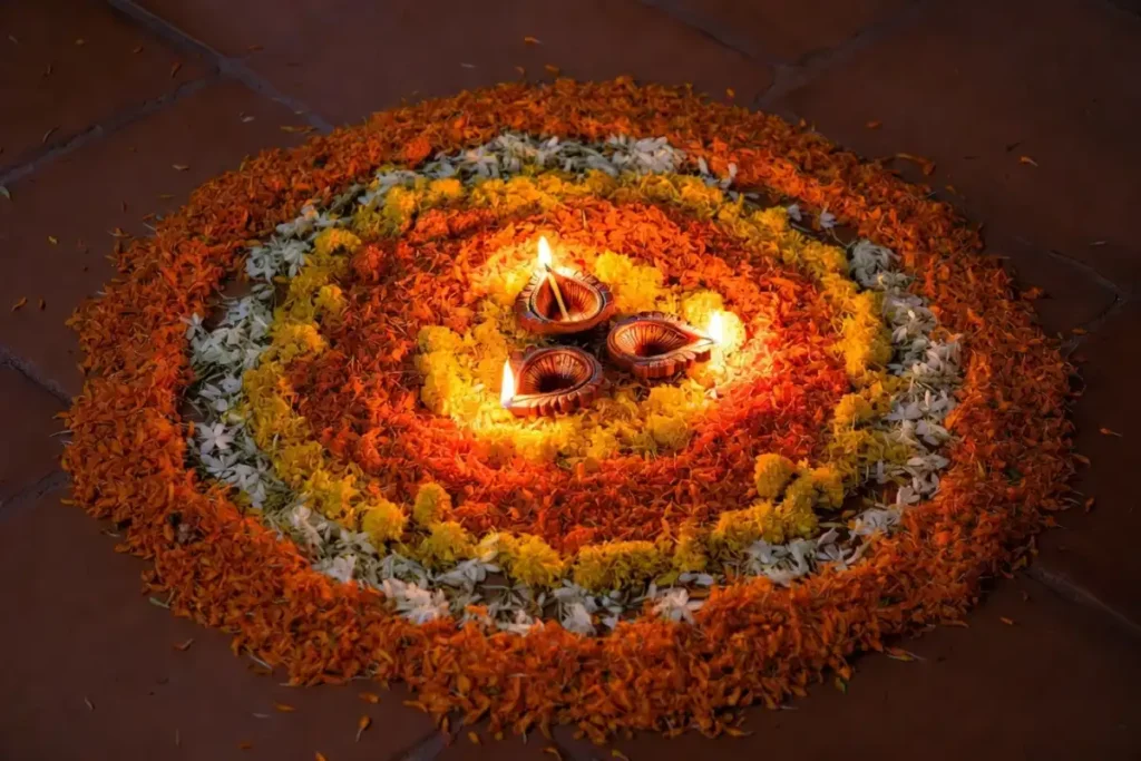 Diwali rangoli design made with marigold petals in a circular mandala pattern
