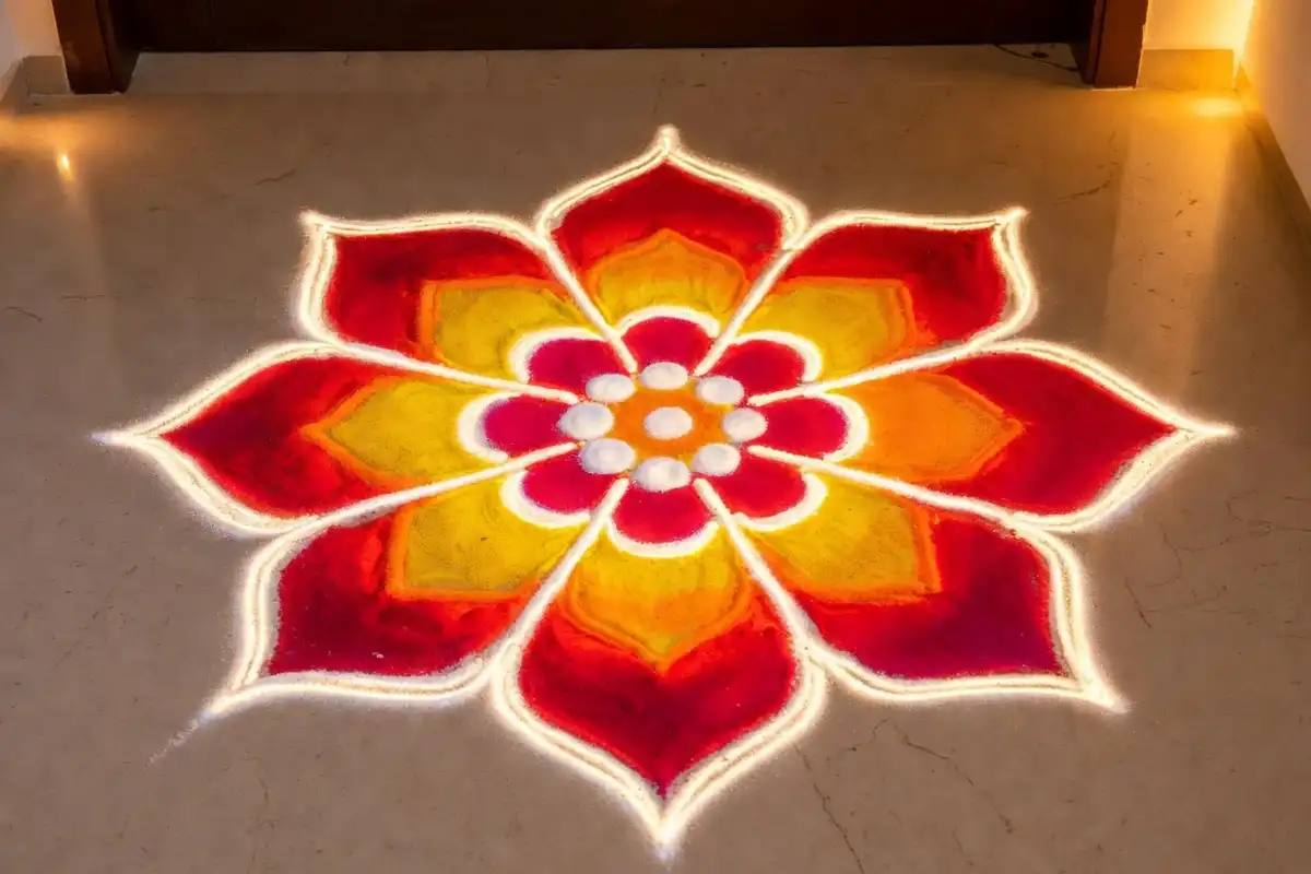 Simple and easy Diwali rangoli design with colorful powder at home entrance