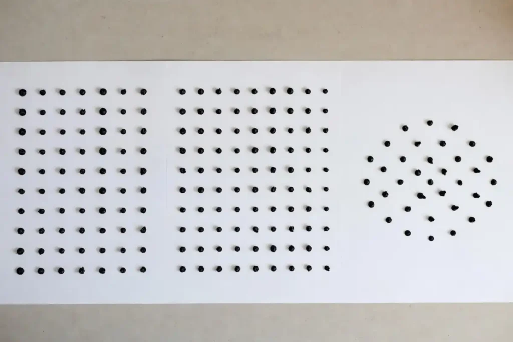 Three types of dot rangoli design grids shown side by side including straight, offset, and radial dot arrangements