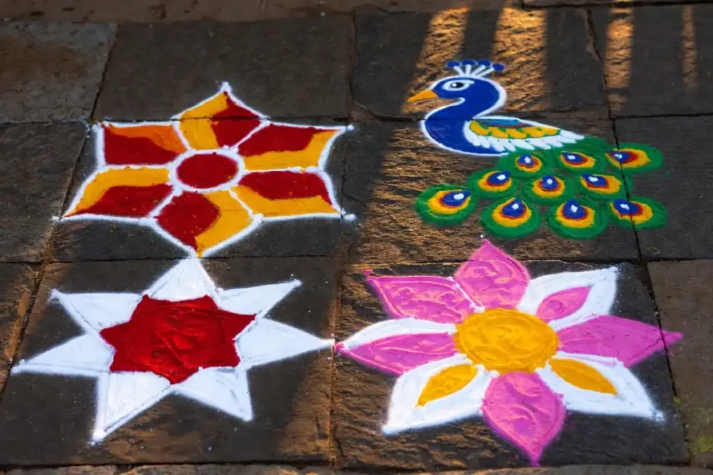 Four dot rangoli design themes including floral, peacock, geometric star, and lotus patterns on a dark floor