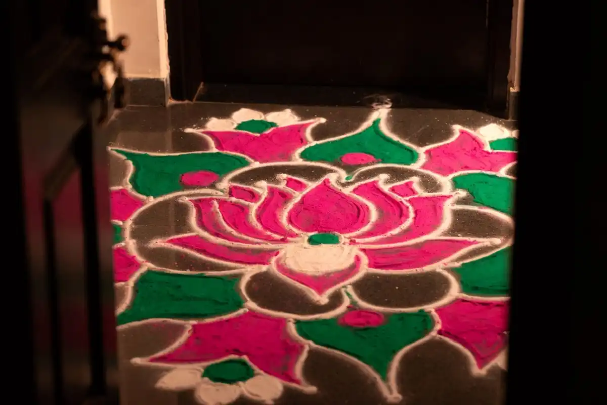 Easy rangoli design for Diwali 2024 drawn at the entrance of a home