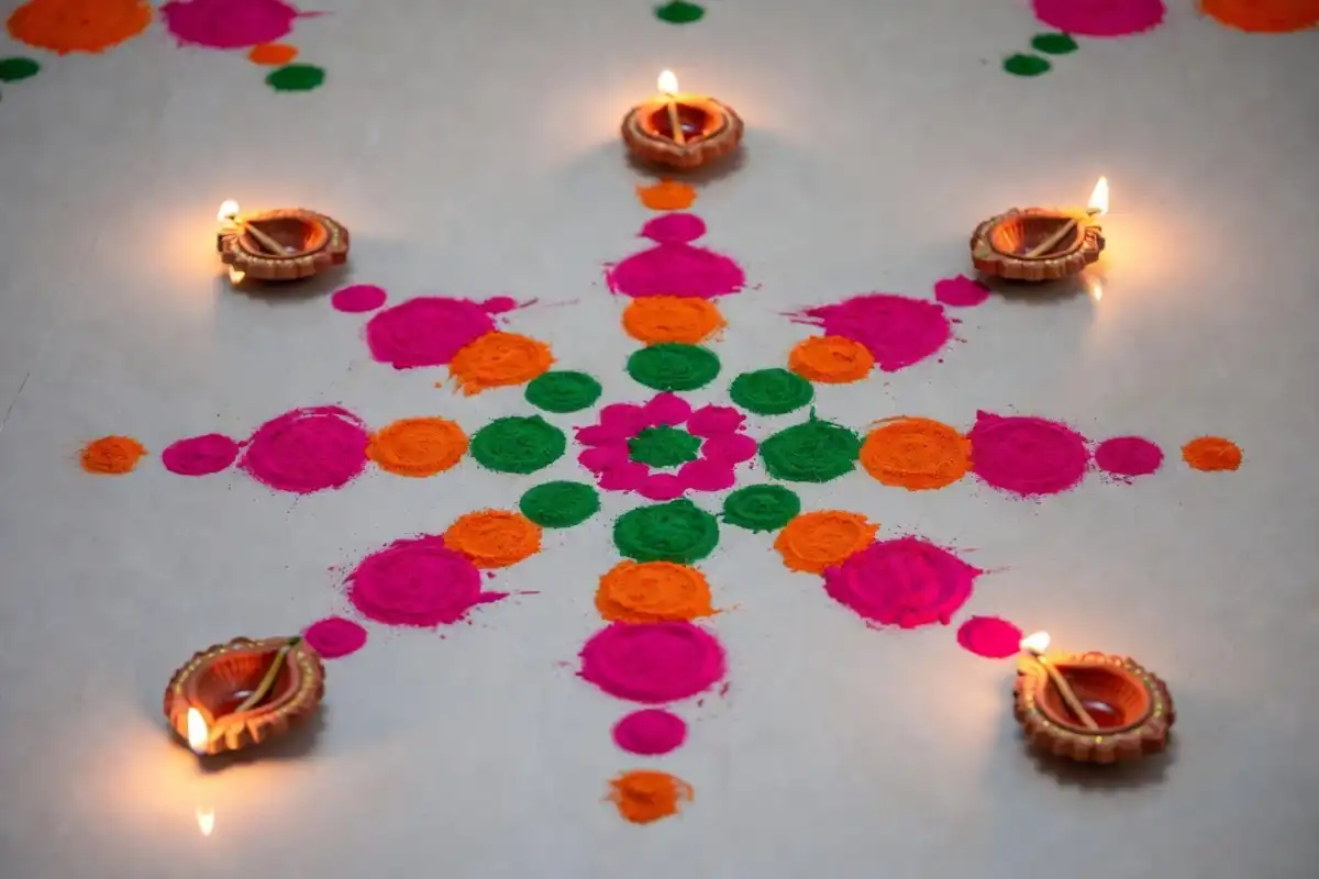 Easy Diwali rangoli made with dots and flower petals in bright colors