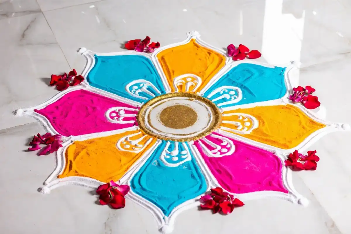 Colorful floral easy rangoli design on white floor