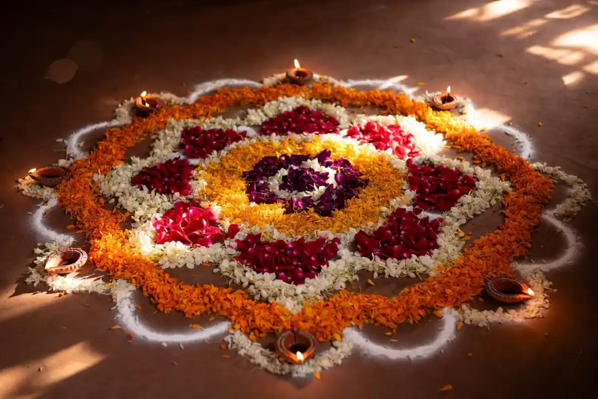 Beautiful floral rangoli design photo made entirely from marigold and rose petals
