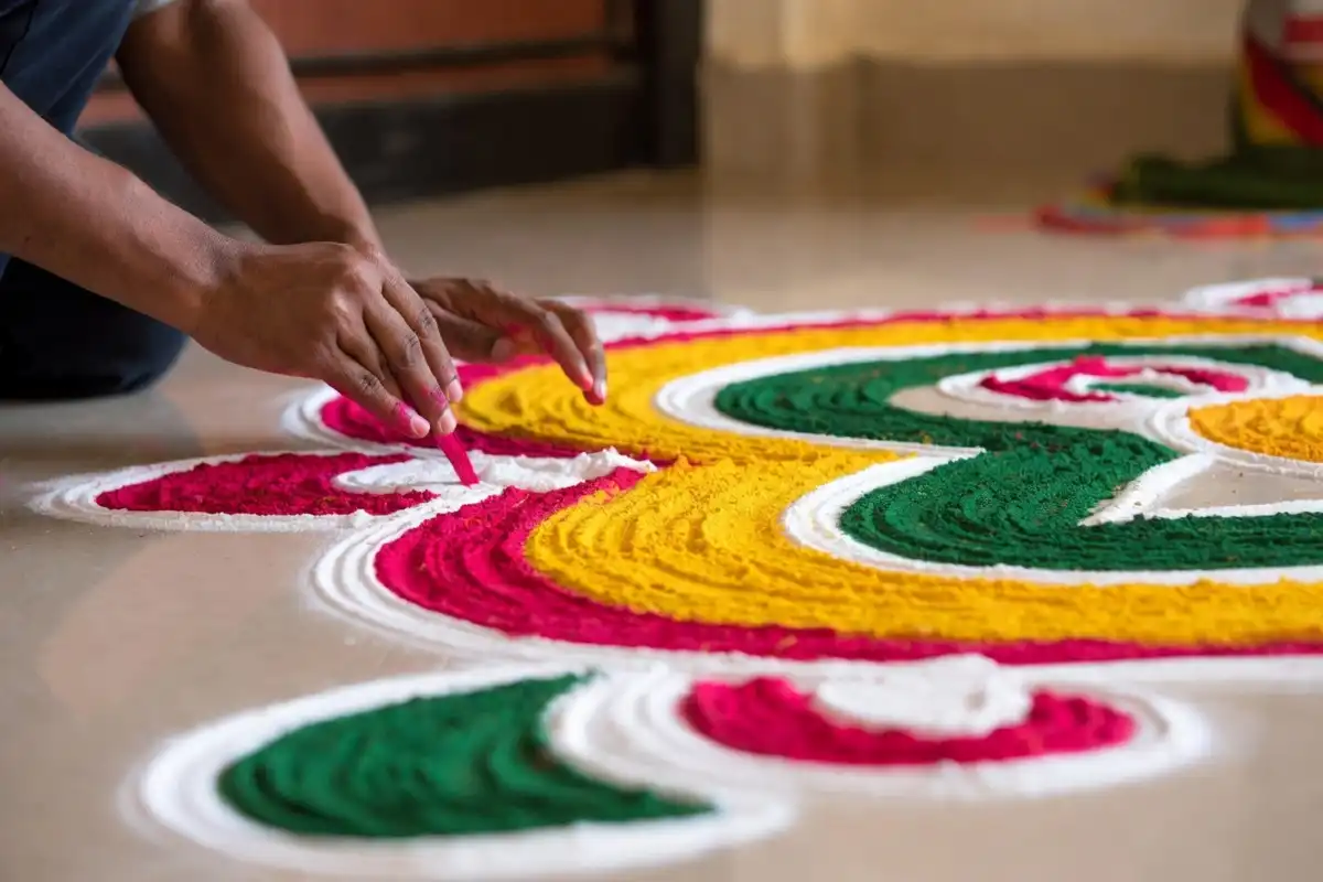 Freehand rangoli border design ideas drawn with colored powder