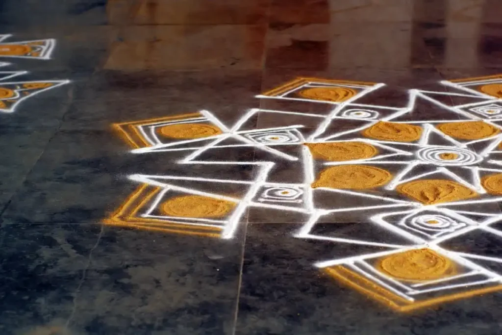 Hand-drawn geometric shapes used in a traditional Indian rangoli floor pattern