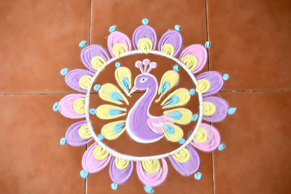 Large peacock circle rangoli design with flower borders for Diwali festival