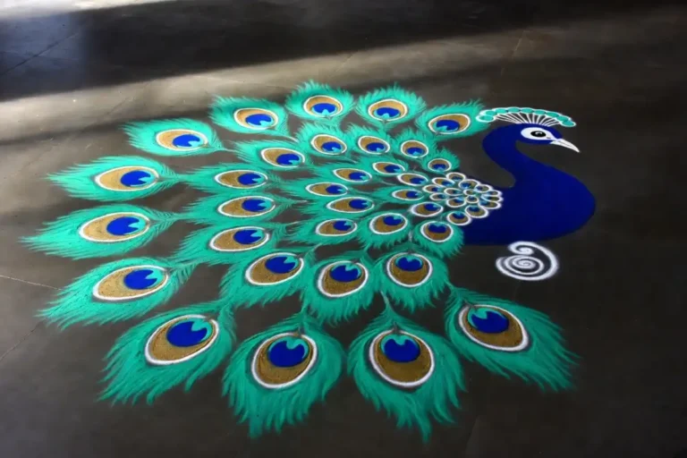 Colorful peacock rangoli design easy to recreate with teal and gold feather patterns on a dark floor
