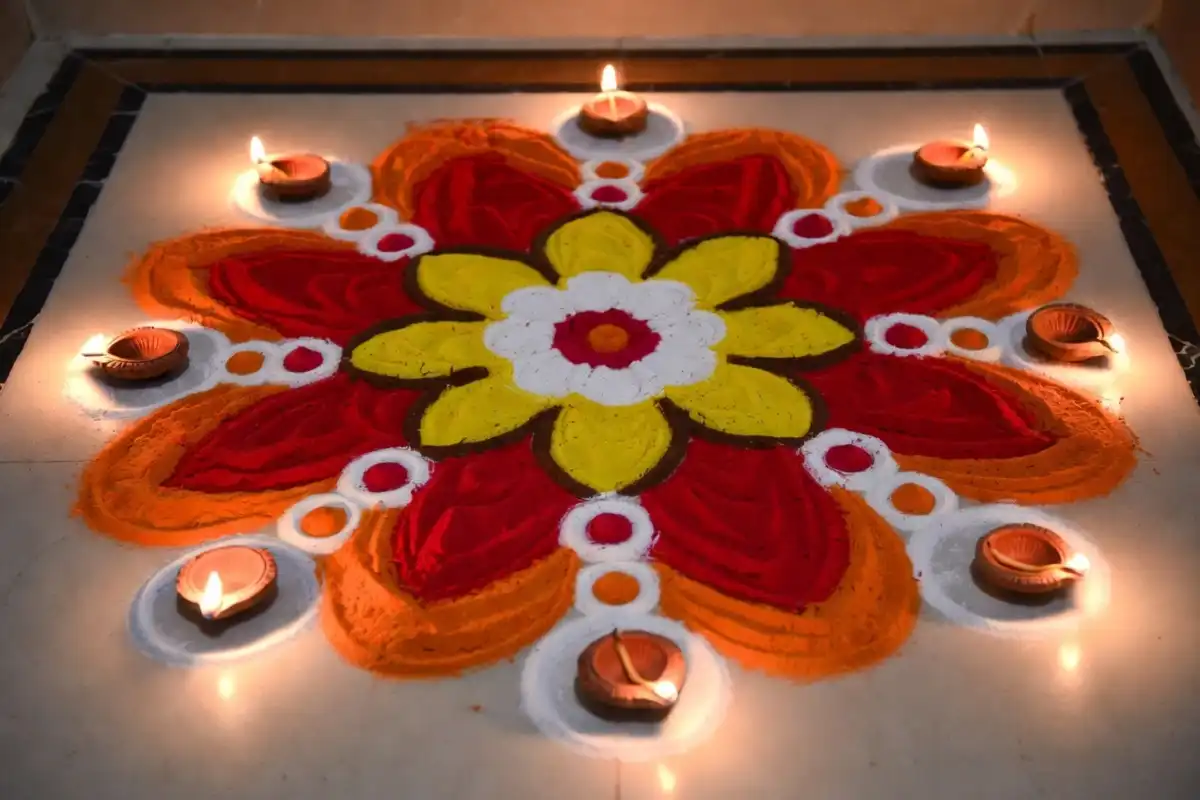 Traditional floral rangoli design for Diwali 2025 with vibrant colors