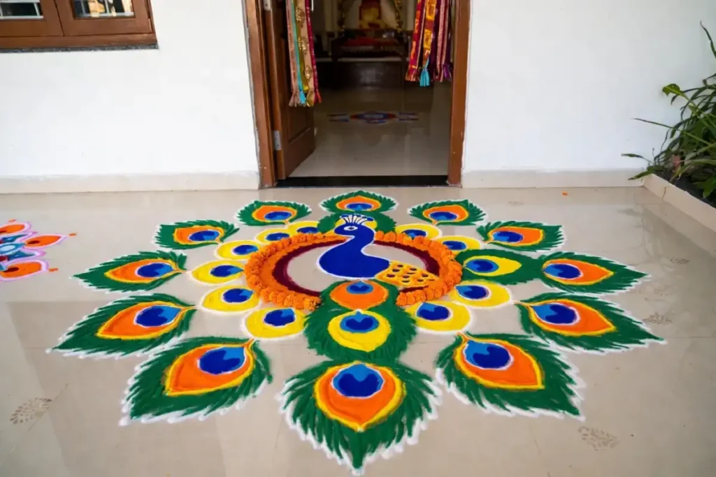 Festive rangoli easy design with peacock motif at home entrance in bright colors