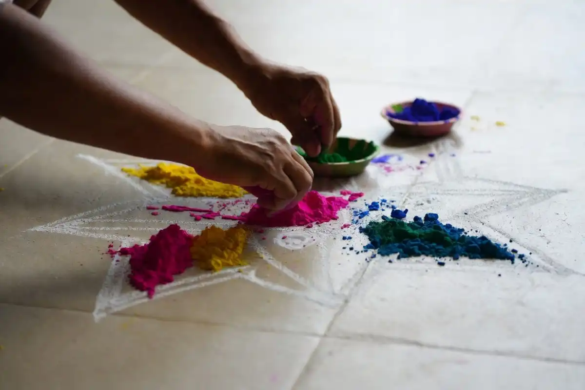 Step-by-step process of creating a rangoli simple design