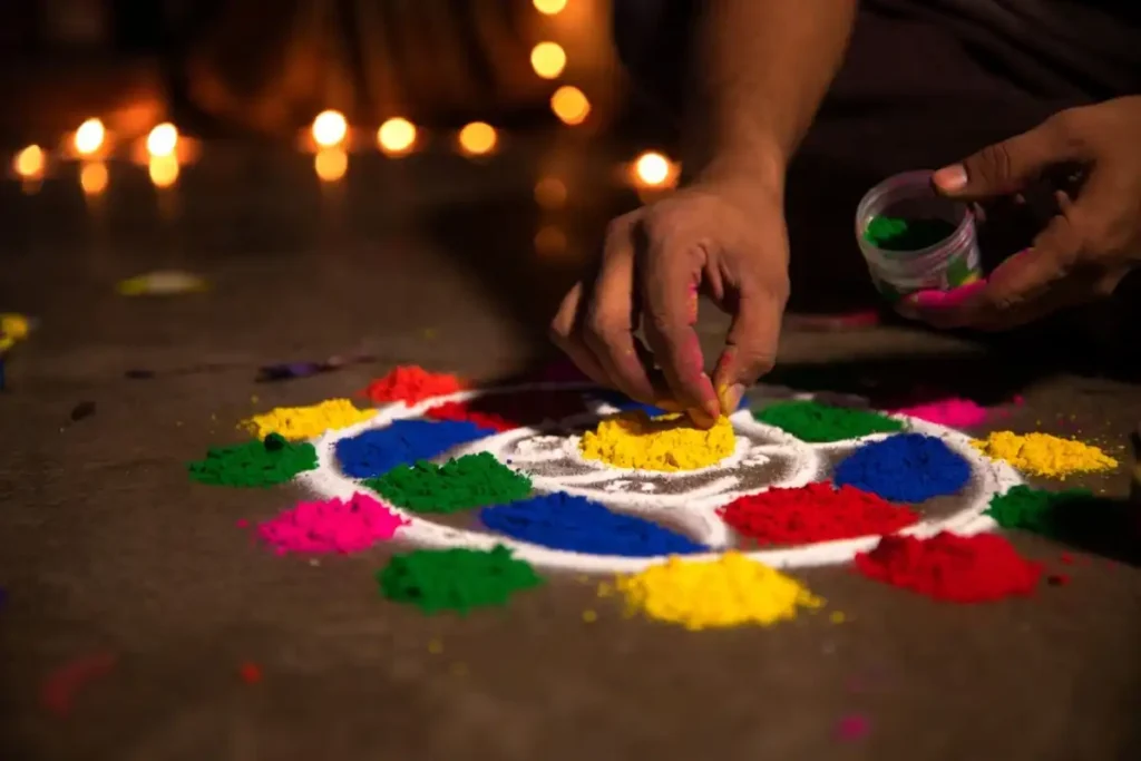 Small dot rangoli pattern being made step by step on a compact floor space