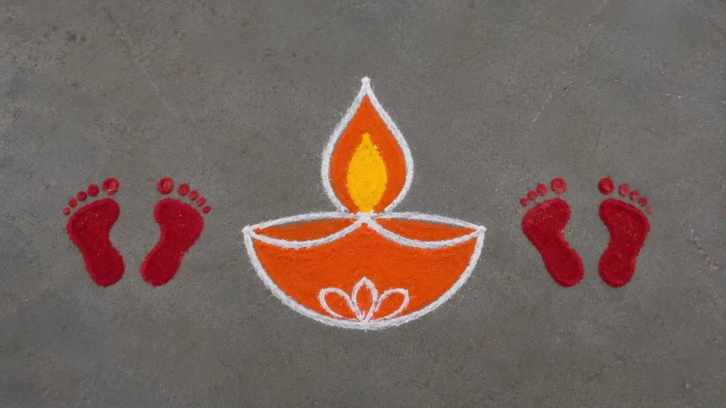 Diya with Lakshmi footprints rangoli design