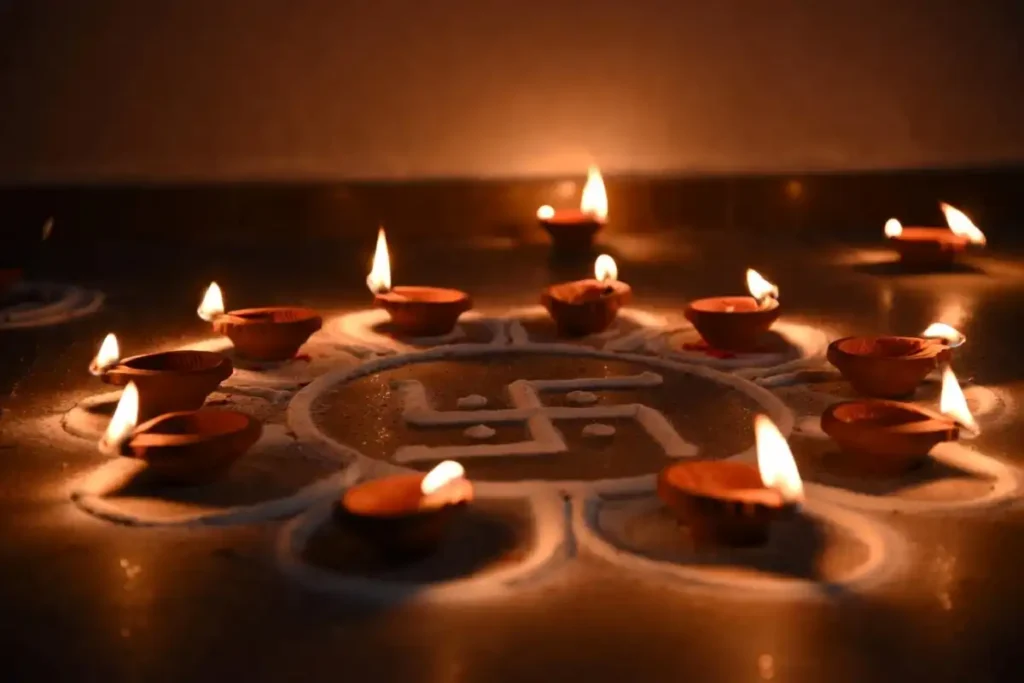 Spiritual rangoli with diyas and swastika for festivals