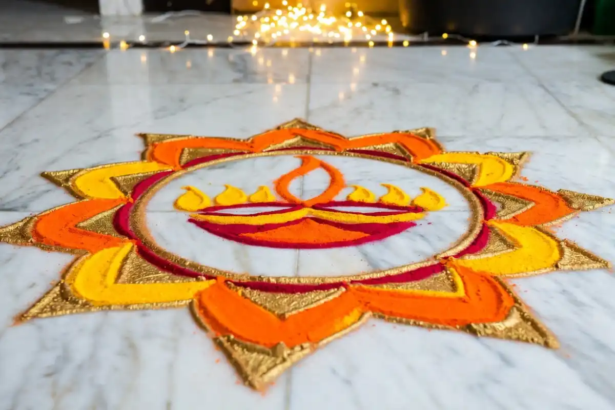 Colorful diya symbol rangoli design on white marble floor for Diwali
