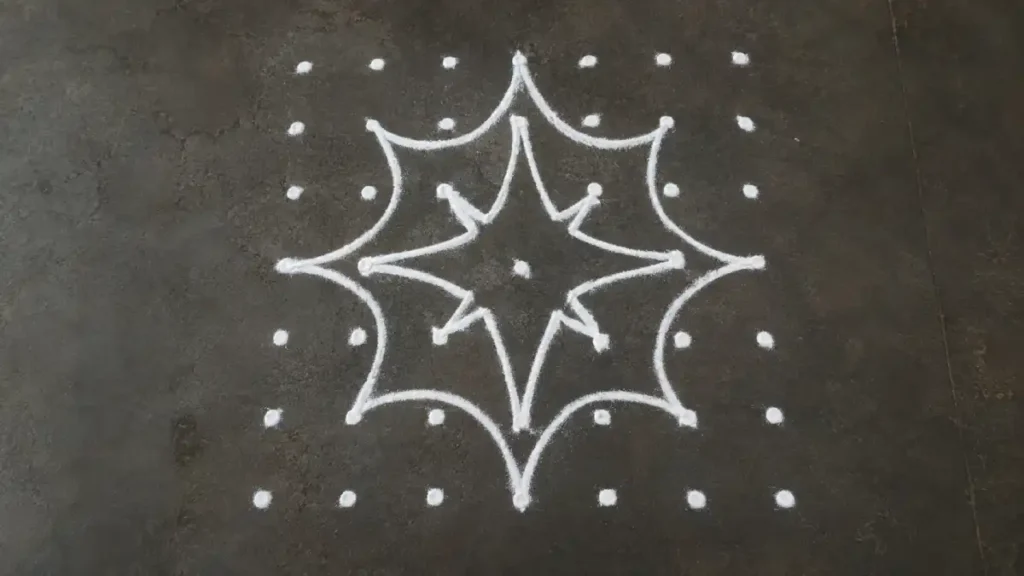 Dot grid rangoli forming an eight-point star pattern using a 7x7 grid layout