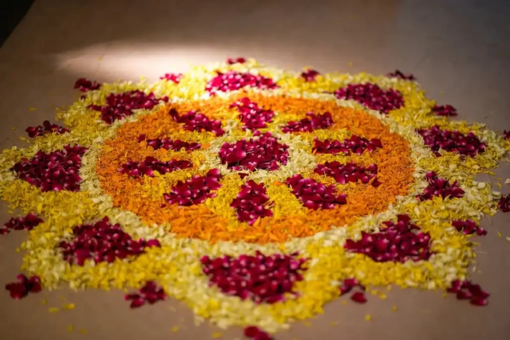 Small festive rangoli made from marigold and rose petals