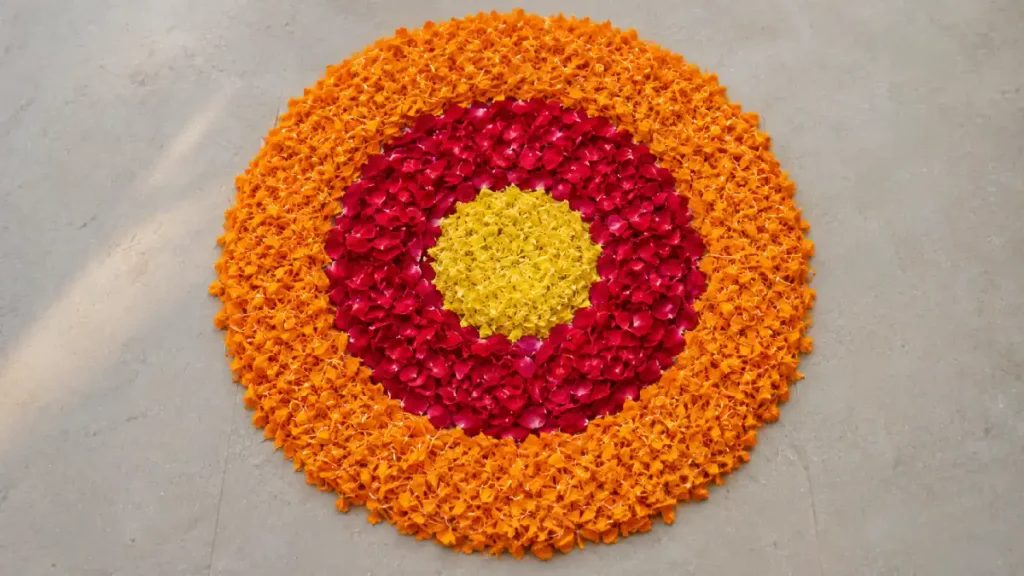 Rangoli made entirely of flower petals arranged in concentric rings without any powder