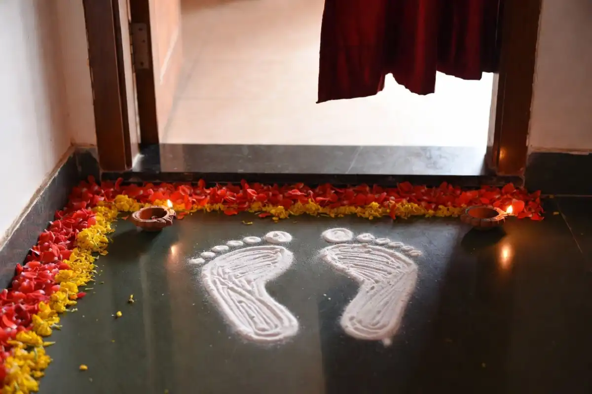lakshmi feet rangoli easy design drawn at home doorway for Diwali
