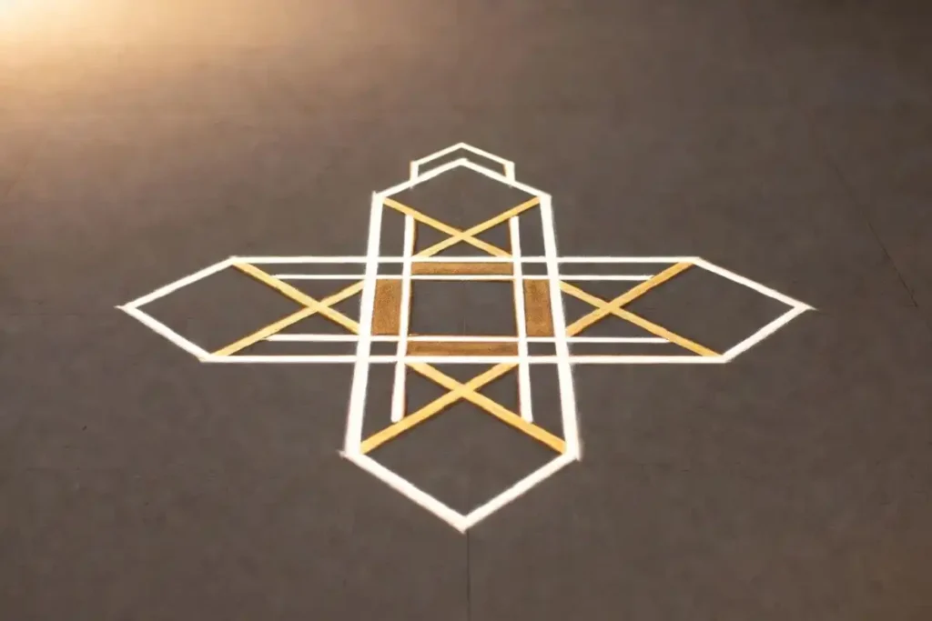 Minimalist modern simple rangoli with white and gold geometric lines on dark grey floor