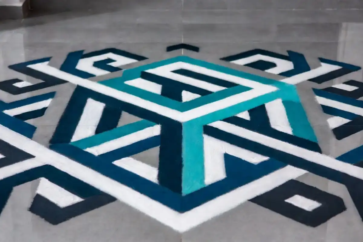 Quick 3D rangoli pattern with pop-out cube design on a clean home floor