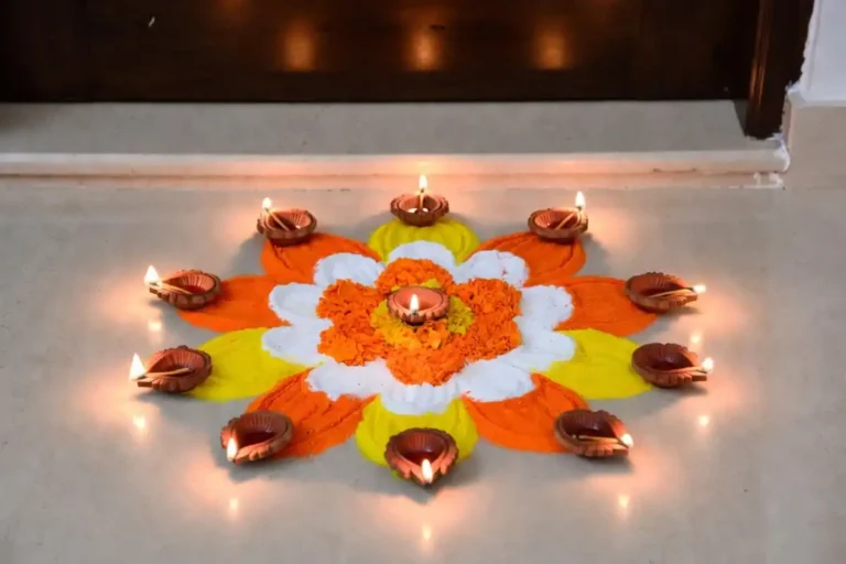 small festive rangoli ideas with diyas on a home doorstep