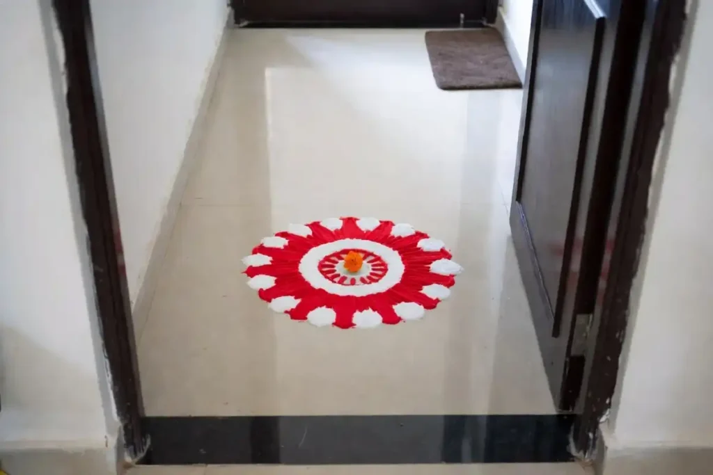 Simple new year rangoli design sized for a small apartment entrance