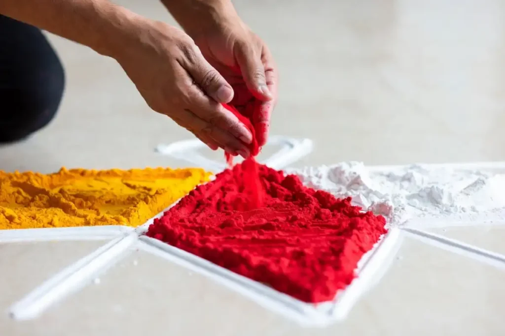  Filling contrasting colors into a geometric rangoli design triangle section