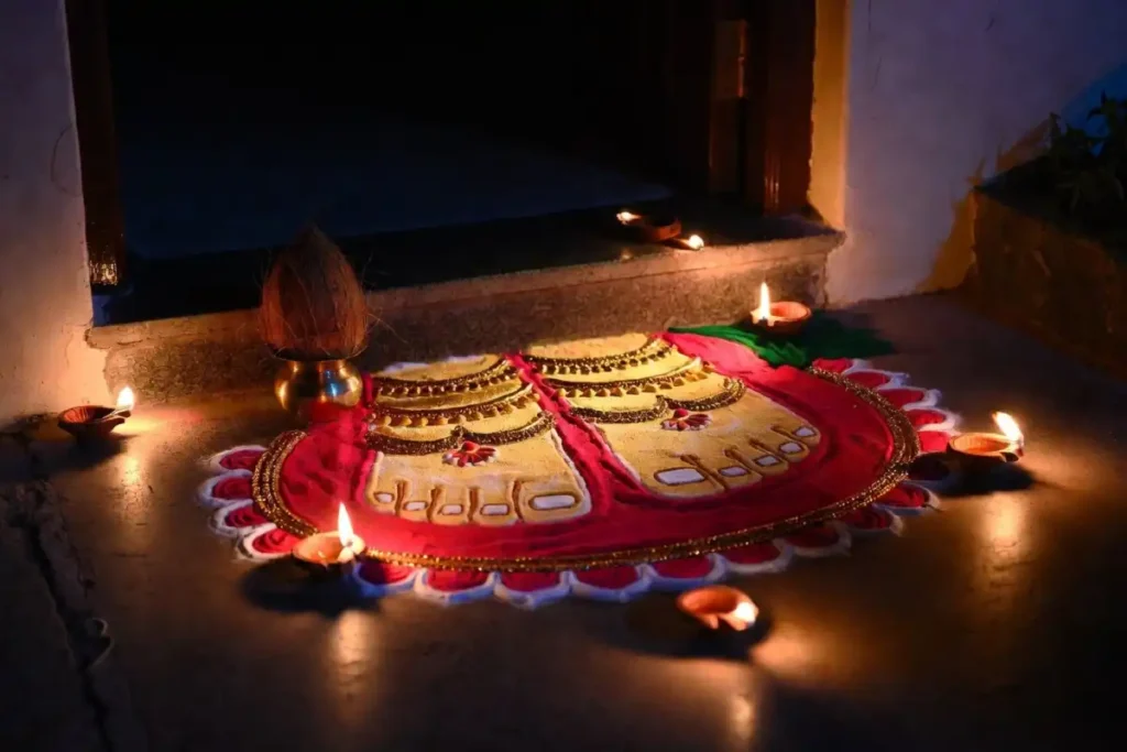 Lakshmi feet design among rangoli designs with Hindu deities for Diwali