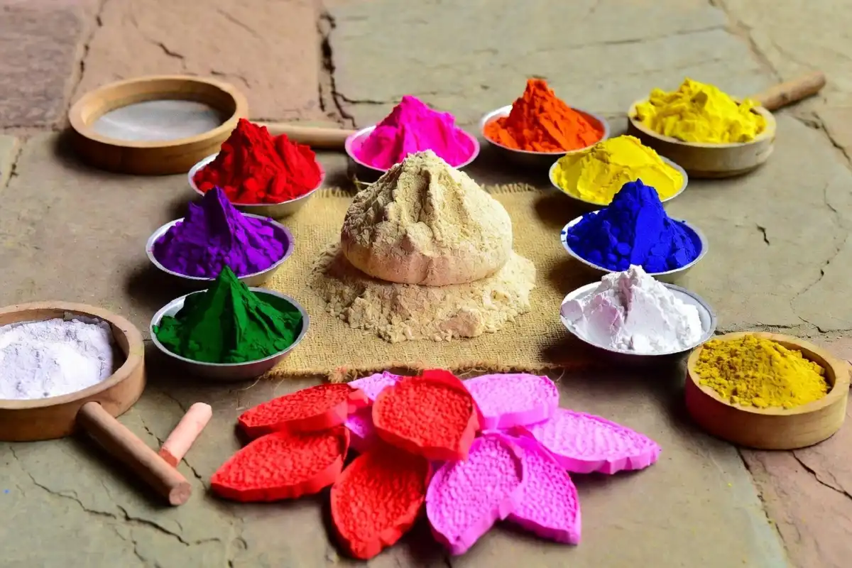 Materials needed for 3D rangoli designs for competition including gulal, rice flour, and thermocol