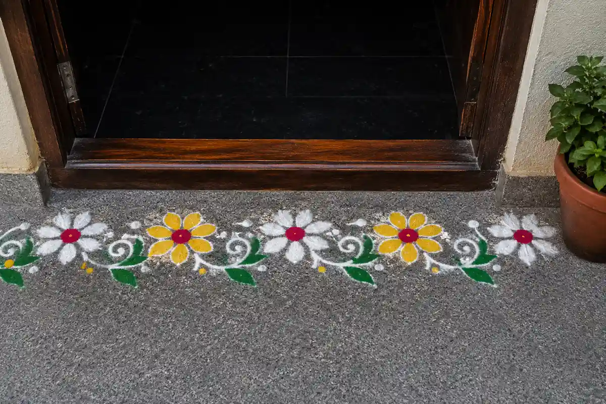 Flower border rangoli at the doorway
