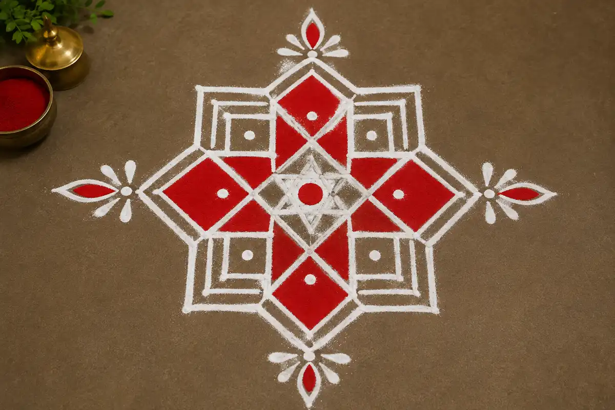 Red and white geometric Rangoli with symmetrical diamond patterns