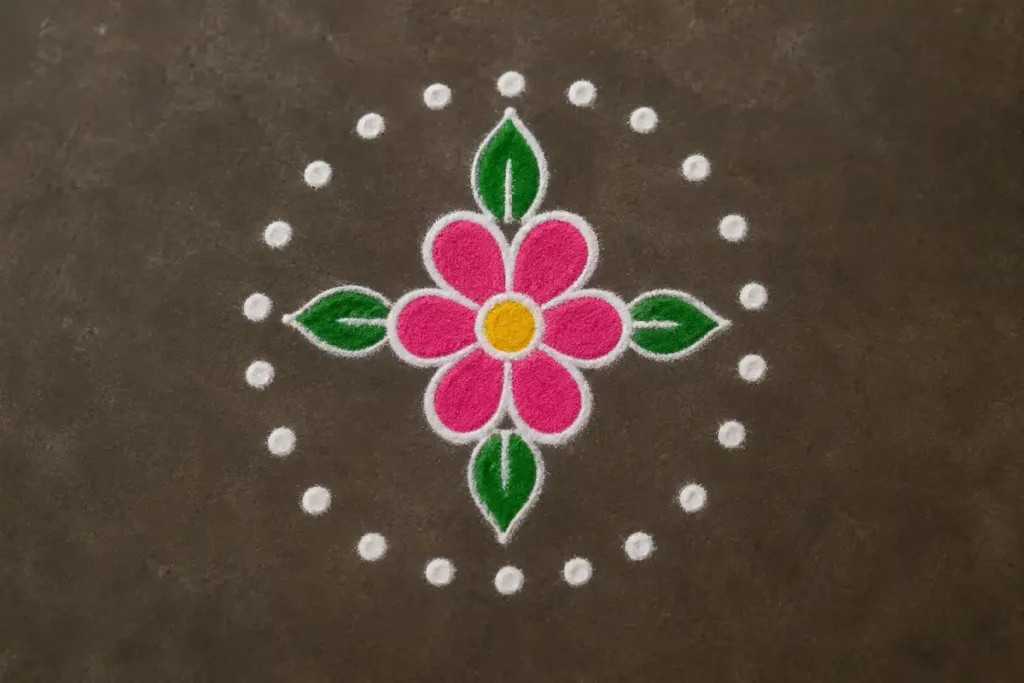 Simple daily flower rangoli with four leaves and a circle of white dots