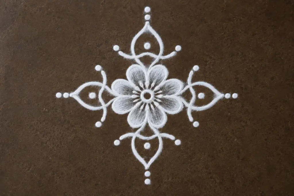 Simple flower kolam design with dots and curved lines for beginners