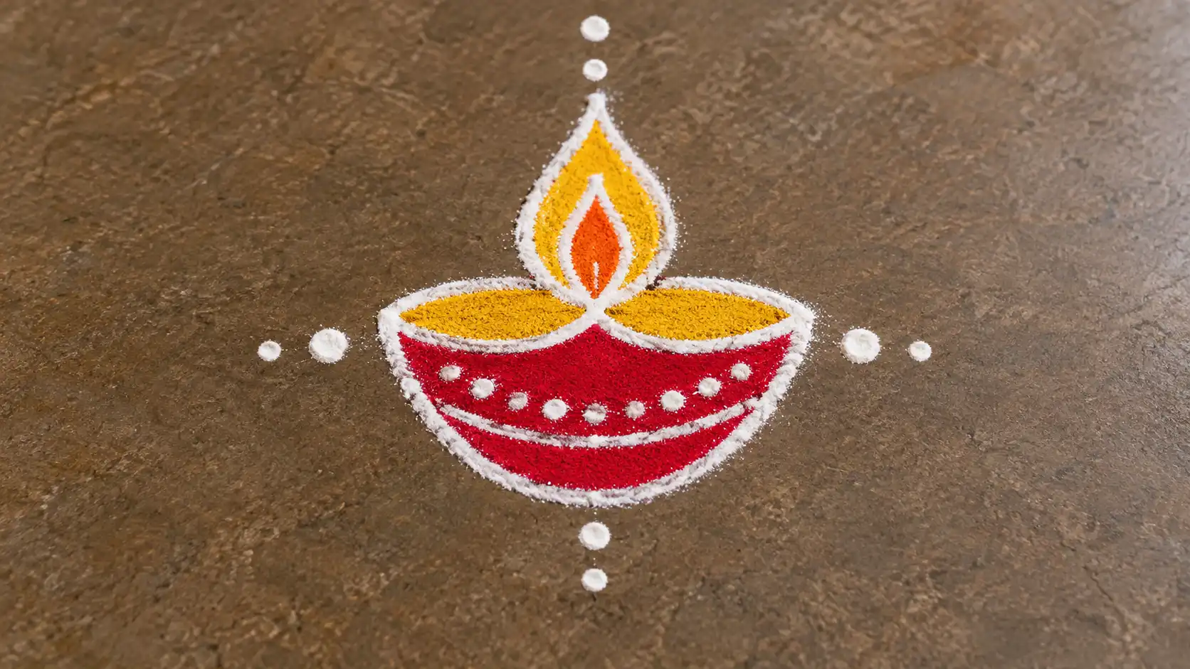 Simple single diya rangoli with white powder outline and colorful flame